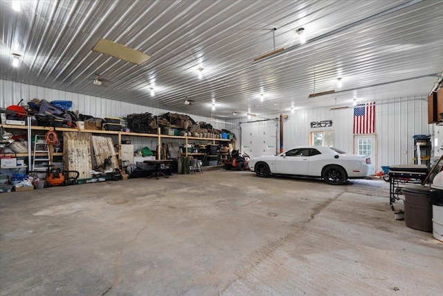 16688 248th St, Long Prairie, MN 56347 - garage featuring metal wall and a workshop area
