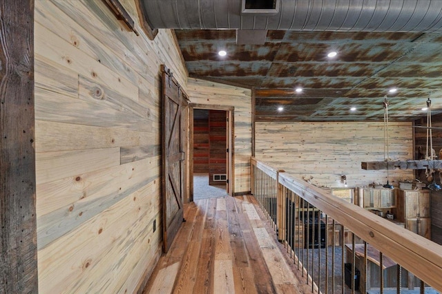 16688 248th St, Long Prairie, MN 56347 - hall featuring wooden walls and wood-type flooring