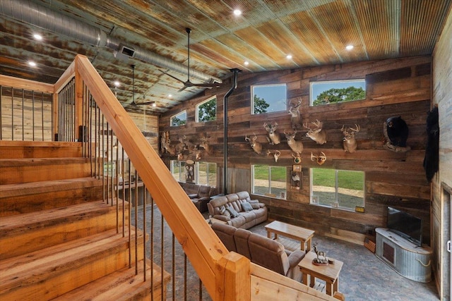16688 248th St, Long Prairie, MN 56347 - living room featuring wood walls, stairway, wooden ceiling, and carpet