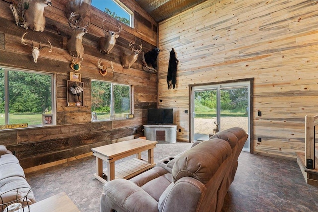 16688 248th St, Long Prairie, MN 56347 - living area featuring wood ceiling, a high ceiling, and wood walls