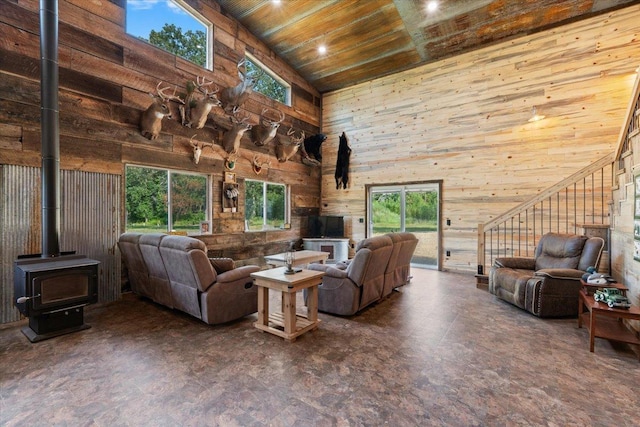 16688 248th St, Long Prairie, MN 56347 - living room with a wood stove, wood ceiling, recessed lighting, a towering ceiling, and wood walls