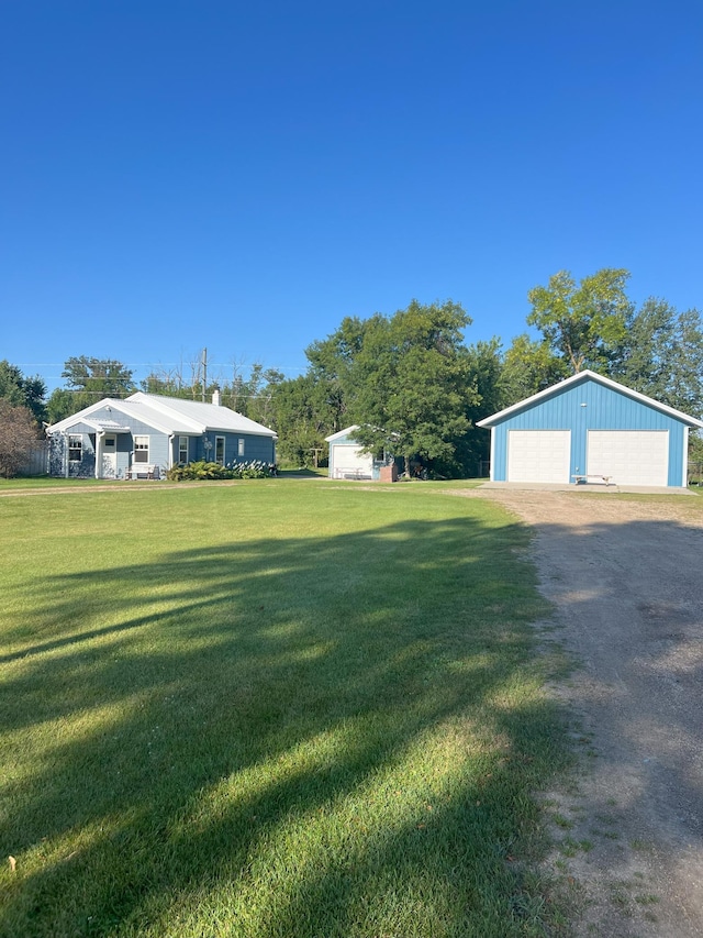 35629 Rush Lake Loop Unit 32, Rush Lake Twp, MN 56571 - view of yard with an outbuilding, driveway, and a detached garage