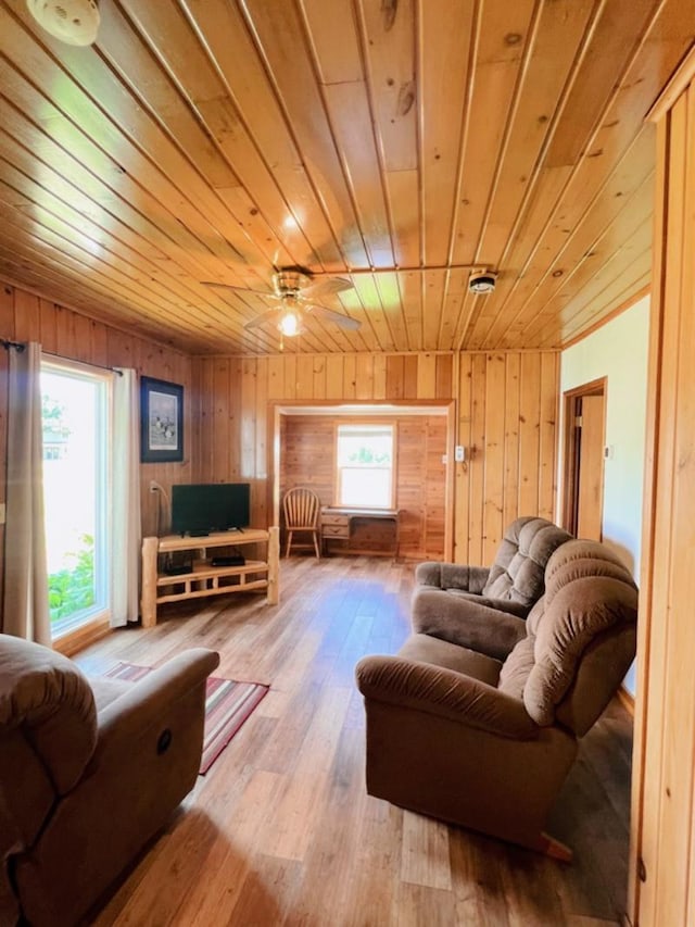 35629 Rush Lake Loop Unit 32, Rush Lake Twp, MN 56571 - living room with hardwood / wood-style floors, a ceiling fan, wooden walls, and wooden ceiling