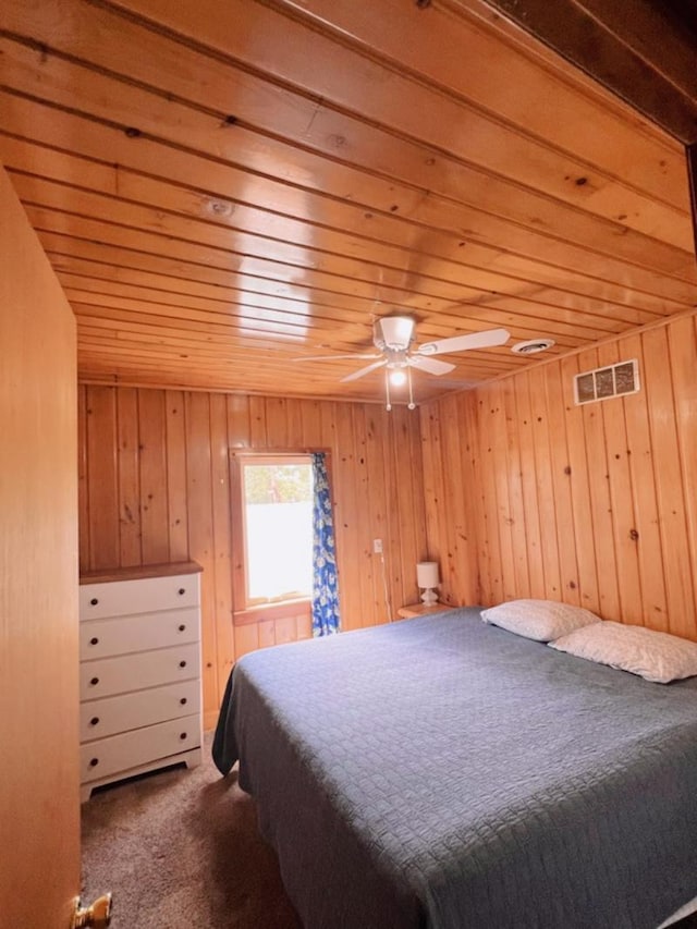 35629 Rush Lake Loop Unit 32, Rush Lake Twp, MN 56571 - bedroom with carpet flooring, wooden walls, visible vents, and wooden ceiling