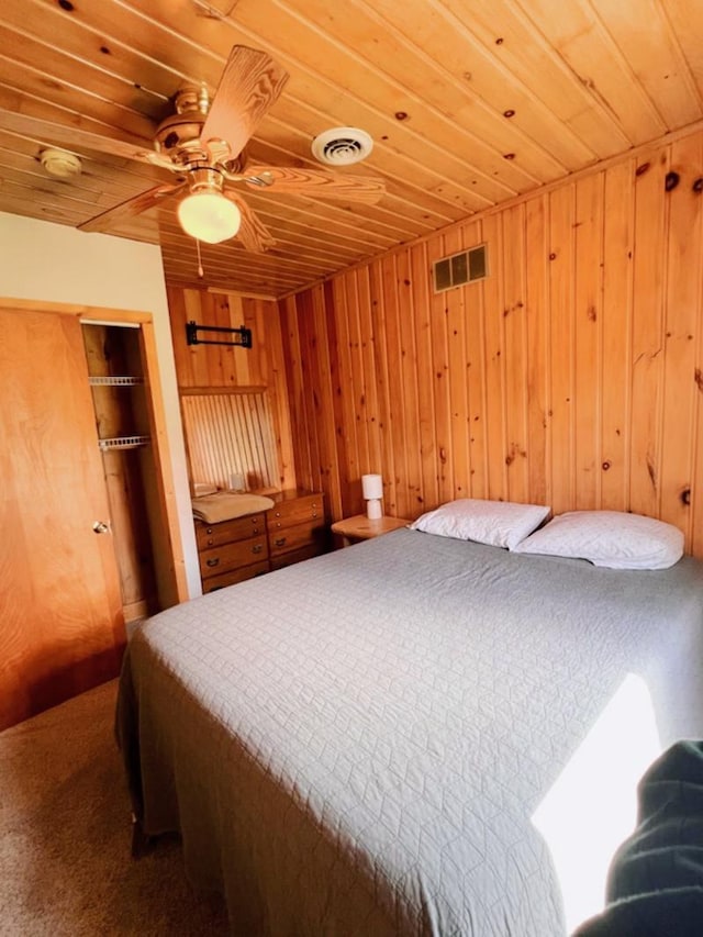 35629 Rush Lake Loop Unit 32, Rush Lake Twp, MN 56571 - carpeted bedroom featuring visible vents, wood walls, and wooden ceiling