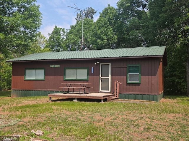 2857 281st Ave, Sterling Twp, WI 54024 - view of front of home featuring a metal roof, a wooden deck, and a front yard