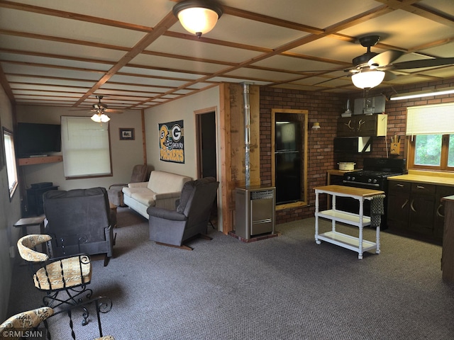 2857 281st Ave, Sterling Twp, WI 54024 - living area with a ceiling fan, dark colored carpet, and brick wall