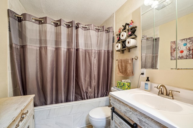 full bathroom with toilet, vanity, shower / bath combo with shower curtain, and a textured ceiling