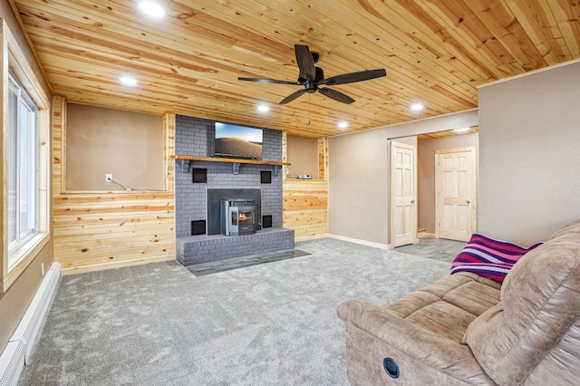 carpeted living room with wood ceiling, wooden walls, a ceiling fan, and recessed lighting