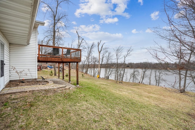 view of yard featuring a deck with water view