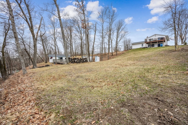 view of yard featuring a wooden deck