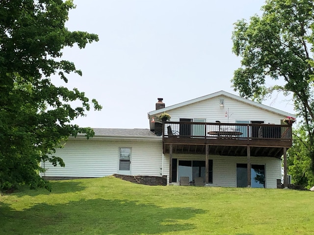 1794 White Ash Dr, Apple River Twp, WI 54810 - back of property with a wooden deck, a lawn, and a chimney