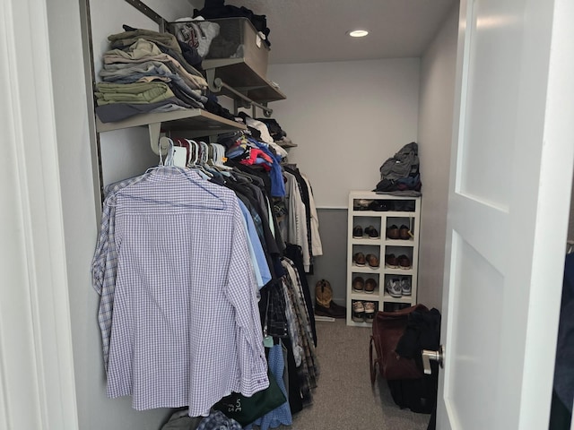 walk in closet featuring carpet
