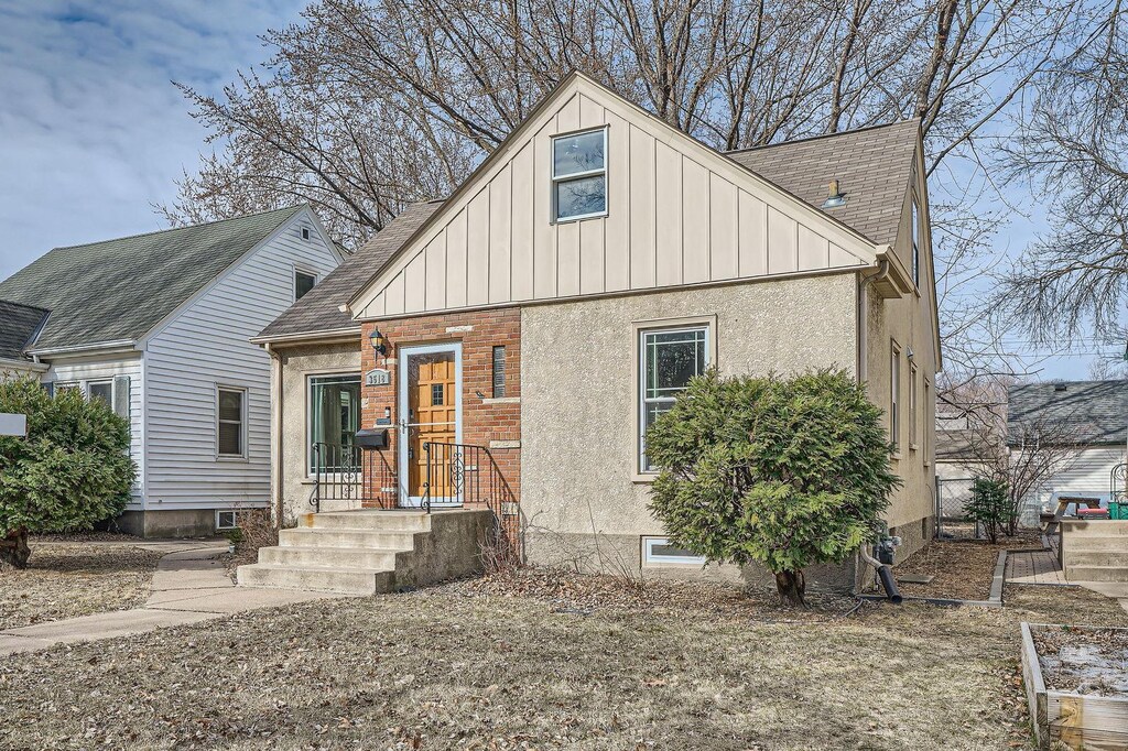 3518 Fillmore St NE, Minneapolis, MN 55418 - view of front of house featuring board and batten siding and roof with shingles