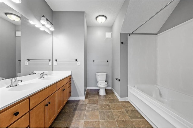 full bath featuring toilet, shower / bath combination, a sink, and baseboards