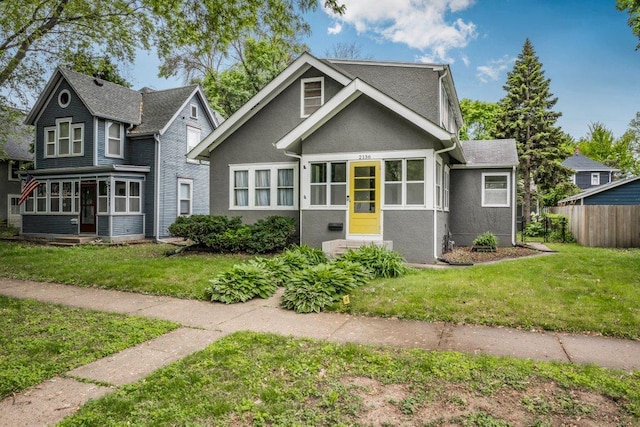2136 Temple Ct, Saint Paul, MN 55104 - view of front of home featuring a sunroom and stucco siding