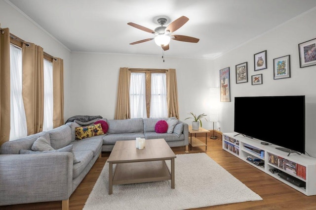 2136 Temple Ct, Saint Paul, MN 55104 - living area featuring a ceiling fan, crown molding, and wood finished floors