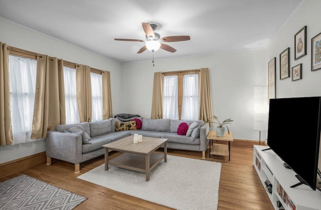 2136 Temple Ct, Saint Paul, MN 55104 - living area featuring ceiling fan, baseboards, crown molding, and wood finished floors