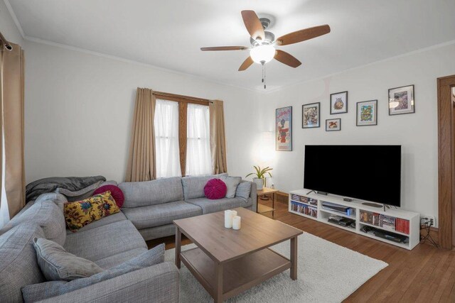2136 Temple Ct, Saint Paul, MN 55104 - living room featuring a ceiling fan, wood finished floors, and crown molding