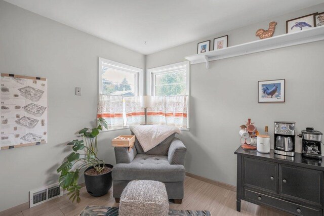 2136 Temple Ct, Saint Paul, MN 55104 - living area with light wood-type flooring and baseboards
