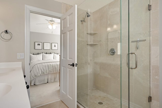 ensuite bathroom with ensuite bathroom, a stall shower, and ceiling fan