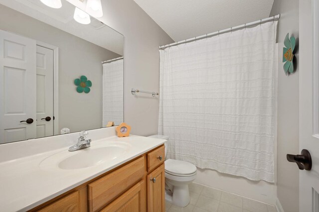 bathroom with vanity, shower / bath combo, and toilet