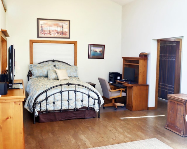 32990 Heilberger Dr, Erhard, MN 56534 - bedroom featuring wood finished floors and a desk