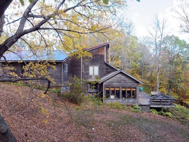 32990 Heilberger Dr, Erhard, MN 56534 - rear view of property featuring a deck and a sunroom