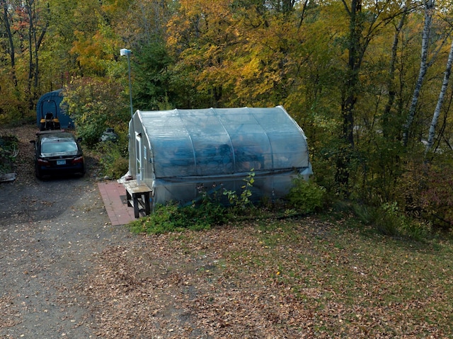 32990 Heilberger Dr, Erhard, MN 56534 - view of greenhouse with a wooded view