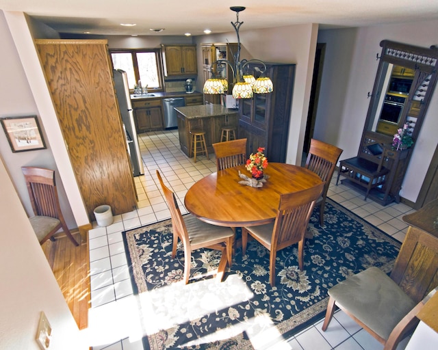 32990 Heilberger Dr, Erhard, MN 56534 - dining room featuring light tile patterned flooring and recessed lighting