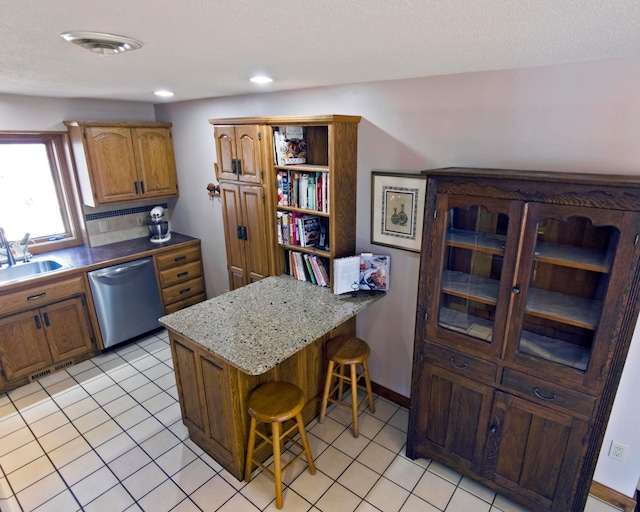 32990 Heilberger Dr, Erhard, MN 56534 - kitchen with stainless steel dishwasher, open shelves, a sink, a peninsula, and a breakfast bar
