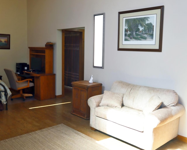 32990 Heilberger Dr, Erhard, MN 56534 - living area featuring wood finished floors and a desk