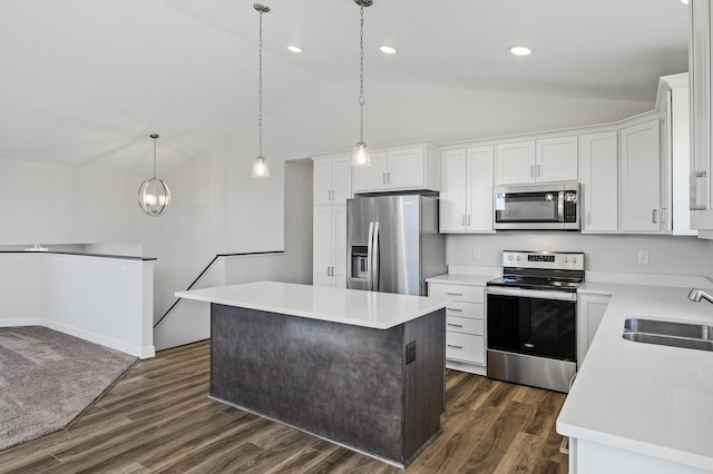 kitchen featuring light countertops, a sink, lofted ceiling, and stainless steel appliances