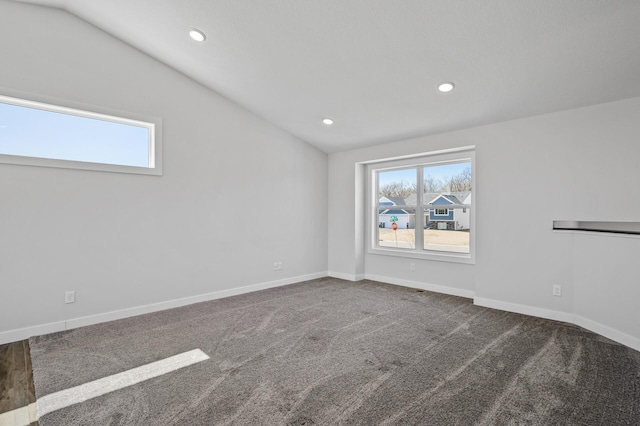 spare room with baseboards, recessed lighting, carpet, and vaulted ceiling