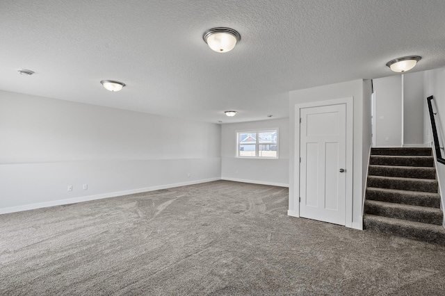 carpeted empty room featuring a textured ceiling, baseboards, and stairs