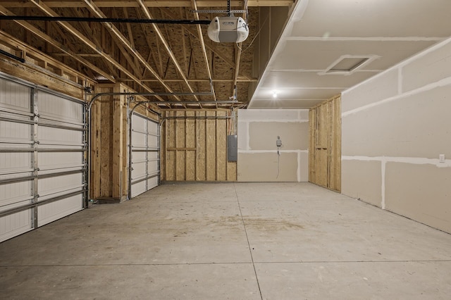garage featuring a garage door opener and electric panel