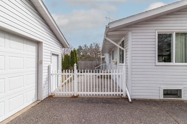 103 8th St N, Sartell, MN 56377 - view of property exterior with fence and a garage