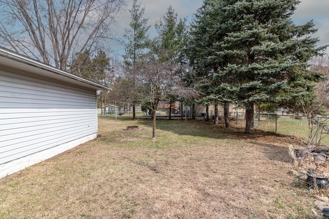 103 8th St N, Sartell, MN 56377 - view of yard with a fire pit and fence