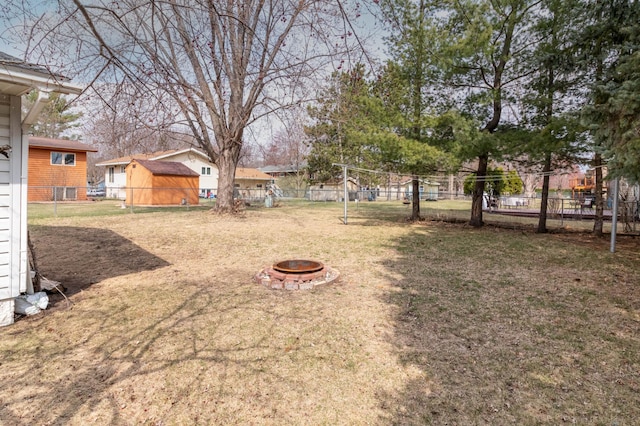 103 8th St N, Sartell, MN 56377 - view of yard with fence and an outdoor fire pit