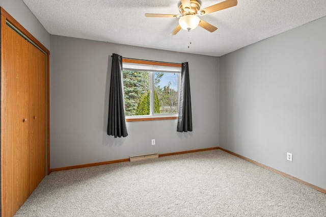 103 8th St N, Sartell, MN 56377 - carpeted spare room with ceiling fan, baseboards, a textured ceiling, and visible vents