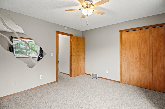 103 8th St N, Sartell, MN 56377 - unfurnished bedroom with carpet flooring, baseboards, visible vents, a closet, and ceiling fan