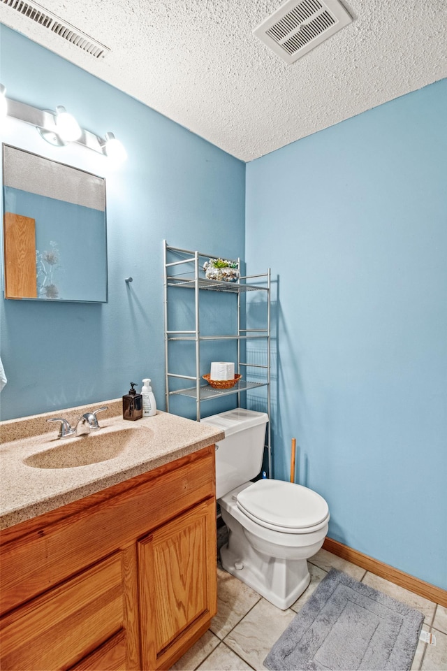103 8th St N, Sartell, MN 56377 - half bathroom with toilet, vanity, a textured ceiling, and visible vents