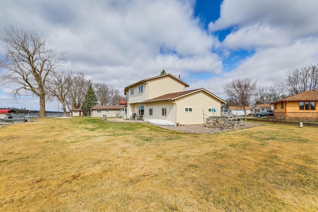 50568 Lakeside Cir, Rush City, MN 55069 - rear view of property featuring a yard and a patio area