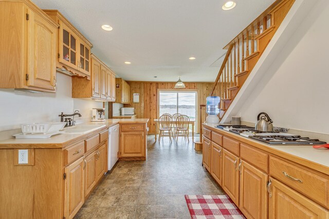 50568 Lakeside Cir, Rush City, MN 55069 - kitchen featuring cooktop, white dishwasher, glass insert cabinets, recessed lighting, and light countertops