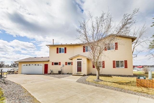 50568 Lakeside Cir, Rush City, MN 55069 - traditional-style home featuring a garage and concrete driveway