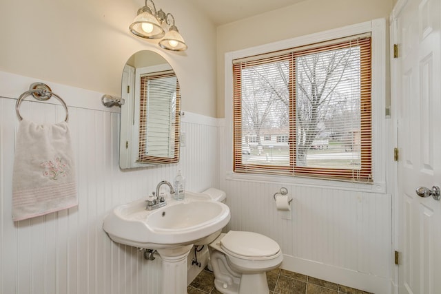 50568 Lakeside Cir, Rush City, MN 55069 - bathroom with a wainscoted wall and toilet