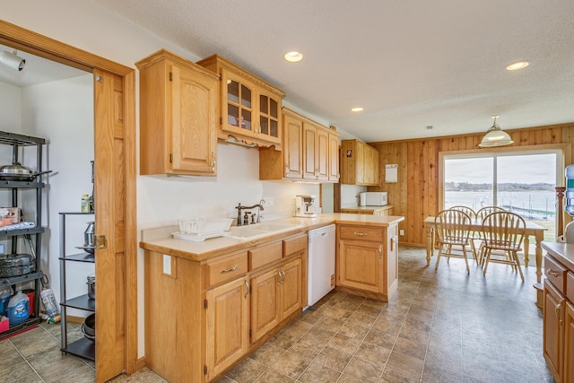 50568 Lakeside Cir, Rush City, MN 55069 - kitchen with white appliances, light countertops, wooden walls, glass insert cabinets, and recessed lighting