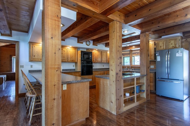 24341 Bluebird Ave, Trommald, MN 56441 - kitchen with black appliances, a wood ceiling with exposed beams, dark wood-style floors, dark countertops, and a center island
