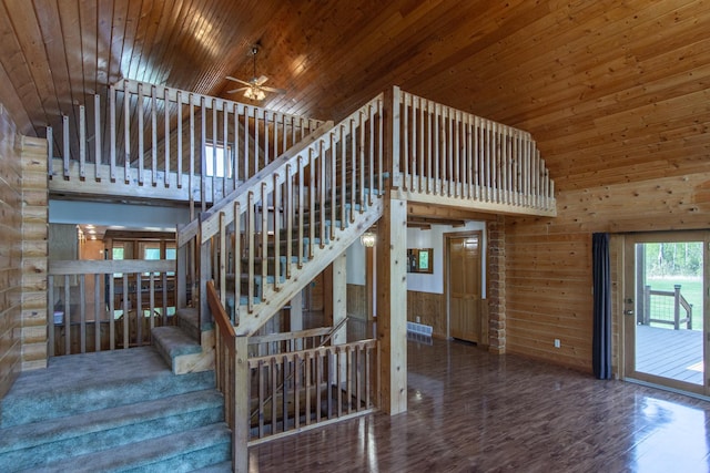 24341 Bluebird Ave, Trommald, MN 56441 - staircase featuring high vaulted ceiling, wood finished floors, wooden walls, ceiling fan, and wooden ceiling