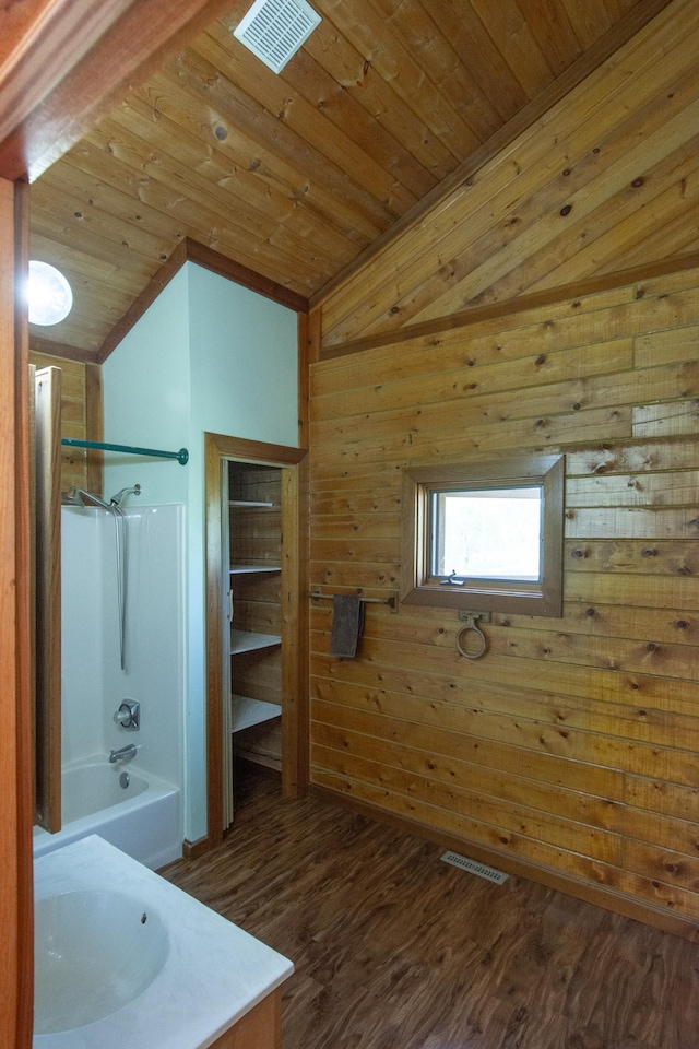 24341 Bluebird Ave, Trommald, MN 56441 - full bathroom with lofted ceiling, wooden walls, wood ceiling, vanity, and wood finished floors